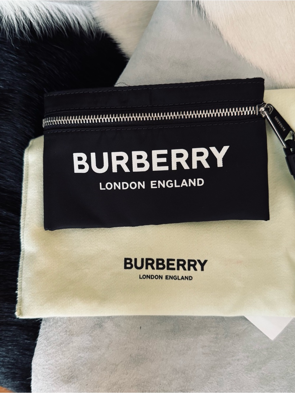 Burberry , Arm wallet with Black elastic back .